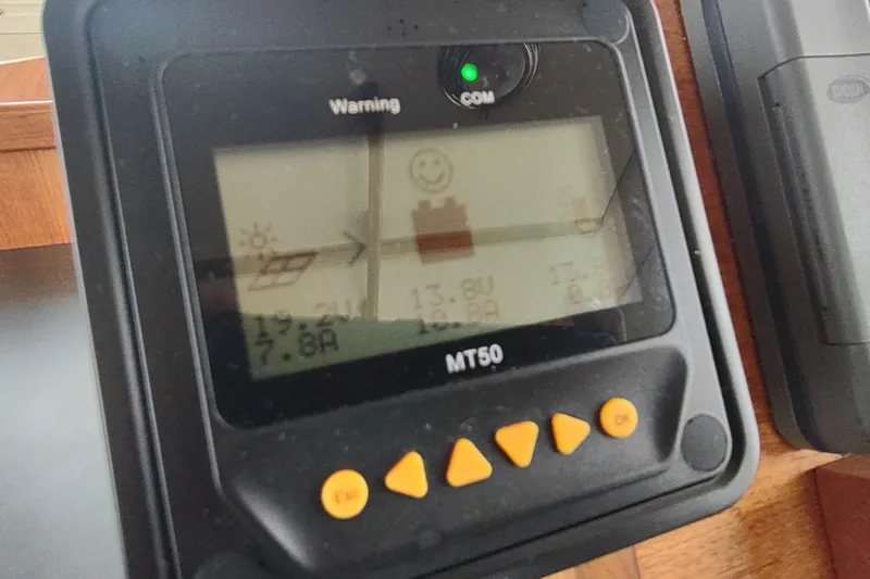 Slide: The Image of MT50 display on 2004 Nordic Tug 32 boat, showing solar panel and battery status. - 34