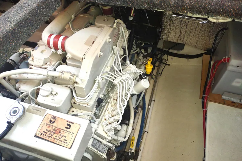 Slide: The Image of Engine compartment of a 2004 Nordic Tug 32, featuring a Cummins diesel engine. - 46