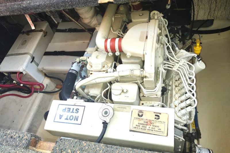 Slide: The Image of Engine compartment of a 2004 Nordic Tug 32, featuring a Cummins marine engine. - 48