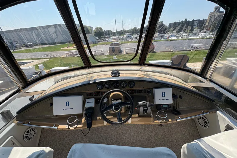 Slide: The Image of Interior of 2003 Carver 360 Sport Sedan with seating and table, overlooking water. - 12