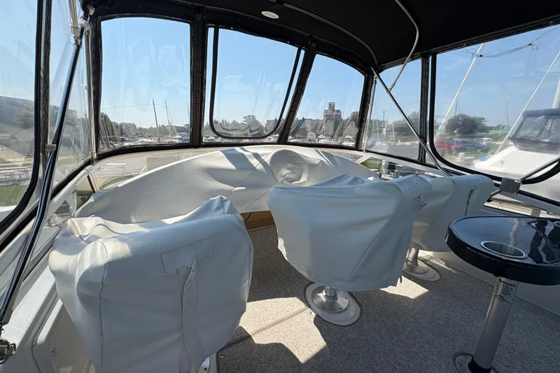 Slide: The Image of Interior view of 2003 Carver 360 Sport Sedan with covered seats and panoramic windows. - 16