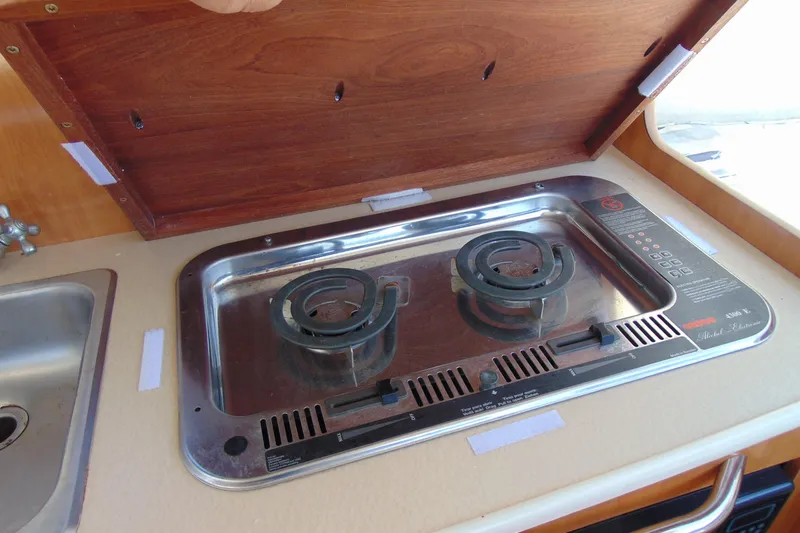 Slide: The Image of Stove and sink in 2002 Bayliner 2452 Ciera Classic boat galley. - 15