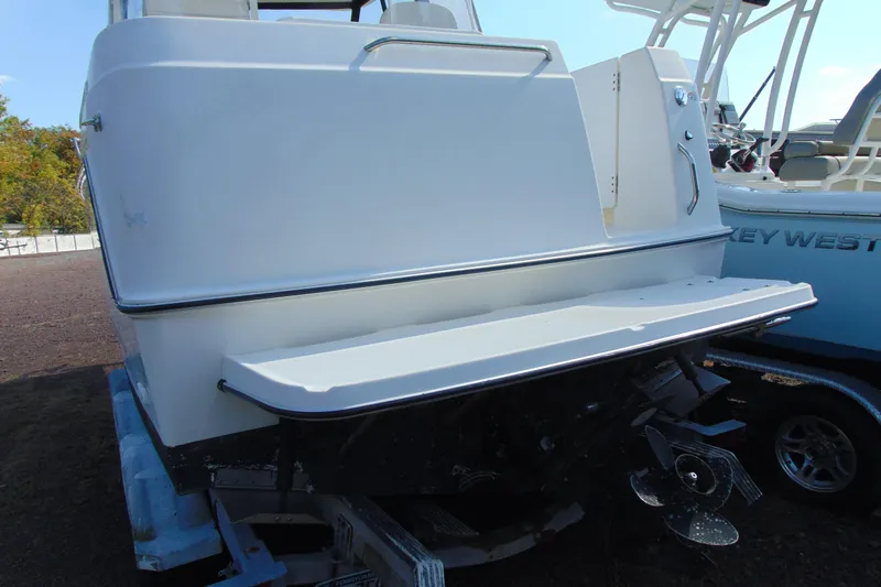 Slide: The Image of 2002 Bayliner 2452 Ciera Classic boat rear view with swim platform and propeller. - 3