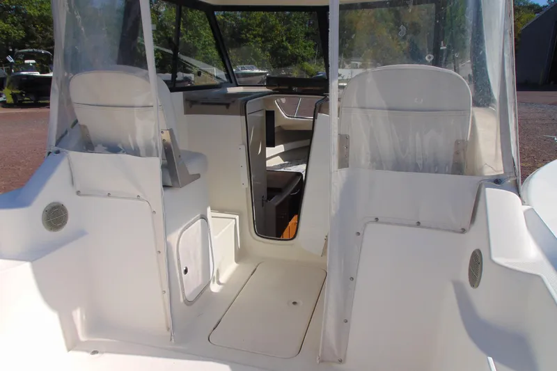 Slide: The Image of 2002 Bayliner 2452 Ciera Classic boat interior with seating and cockpit view. - 4