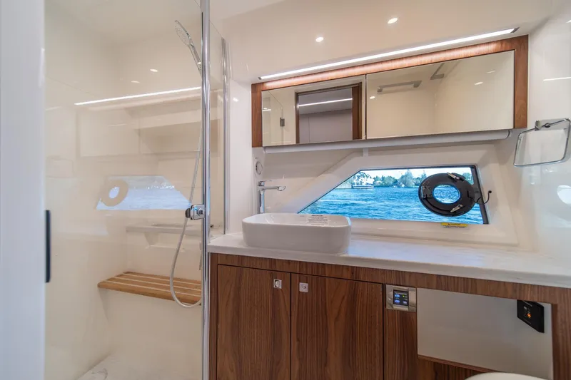 Slide: The Image of Luxurious bathroom interior of 2024 Riviera 505 SUV yacht with modern fixtures and ocean view. - 20