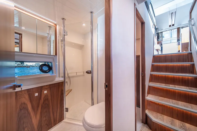 Slide: The Image of Luxurious bathroom interior of 2024 Riviera 505 SUV yacht with wooden accents and modern fixtures. - 22