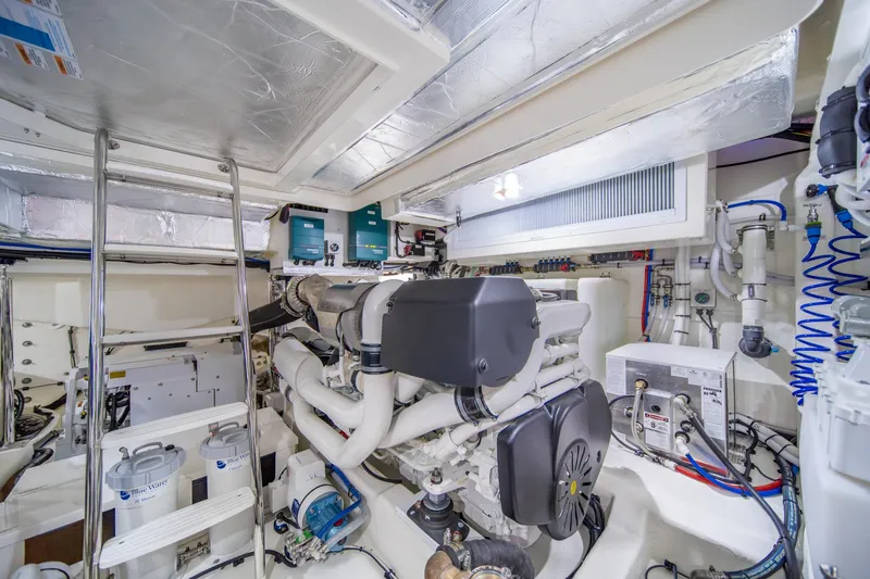 Slide: The Image of Engine room of 2024 Riviera 505 SUV, showcasing advanced marine machinery and equipment. - 30