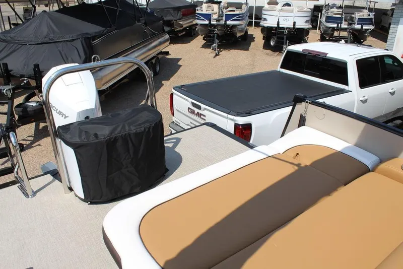 Slide: The Image of 2026 Avalon Catalina Versatile Rear Bench 25 FT boat in a dealership lot. - 14
