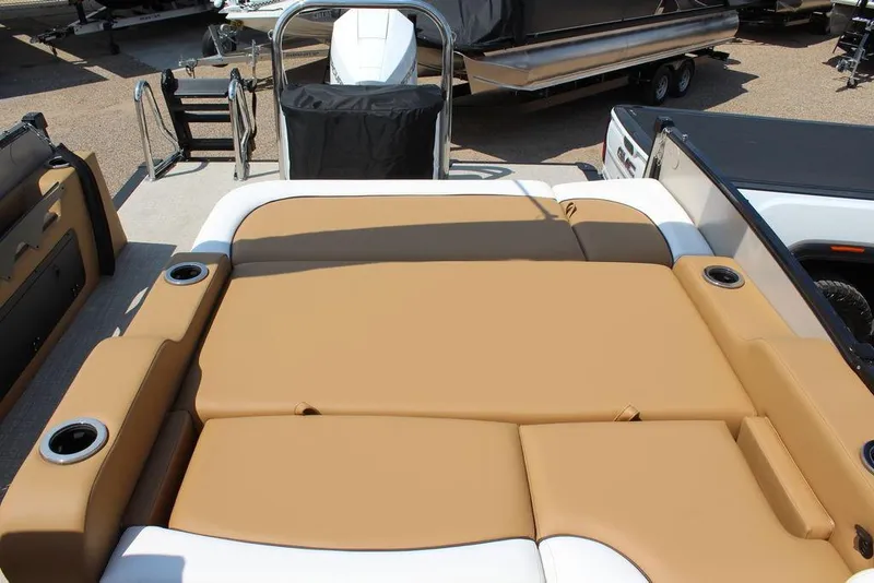 Slide: The Image of 2026 Avalon Catalina Versatile Rear Bench 25 FT with tan seating and cup holders. - 15