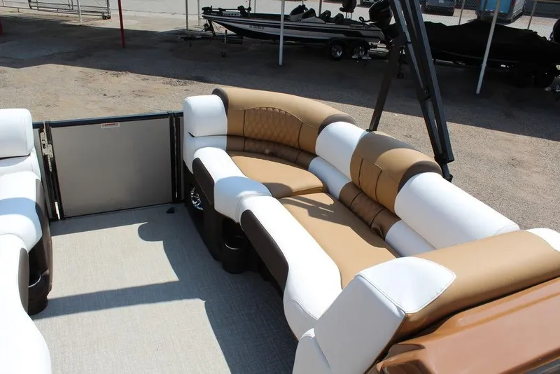Slide: The Image of 2026 Avalon Catalina Versatile Rear Bench 25 FT with luxurious tan and white seating. - 20