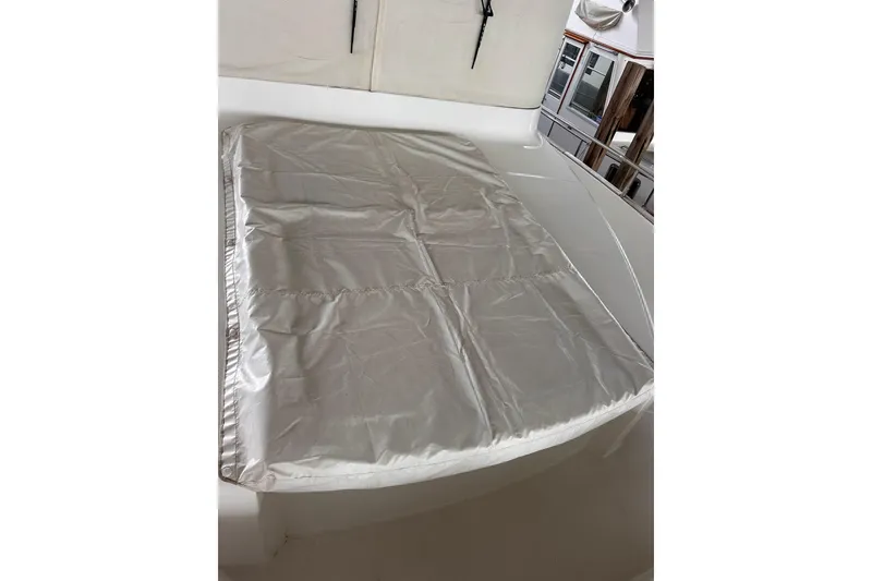 Slide: The Image of 2015 Beneteau Swift Trawler 50 deck with protective cover. - 18