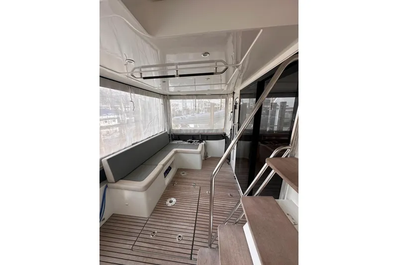 Slide: The Image of 2015 Beneteau Swift Trawler 50 interior with seating and wooden flooring. - 37