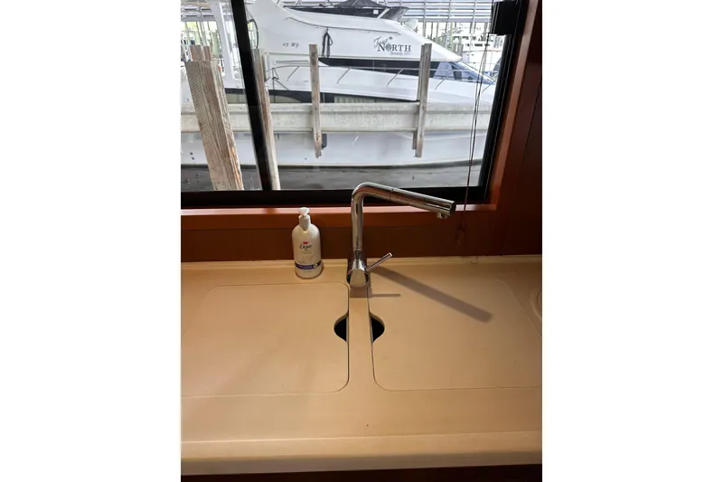 Slide: The Image of 2015 Beneteau Swift Trawler 50 kitchen sink with faucet and soap dispenser. - 45