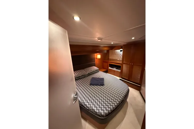 Slide: The Image of Luxurious bedroom interior of 2015 Beneteau Swift Trawler 50 yacht. - 84