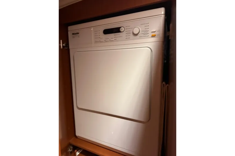 Slide: The Image of Miele dryer inside 2015 Beneteau Swift Trawler 50 yacht cabinet. - 85