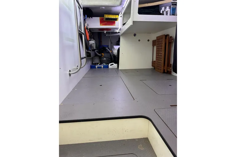 Slide: The Image of 2015 Beneteau Swift Trawler 50 interior storage area with equipment and shelving. - 91