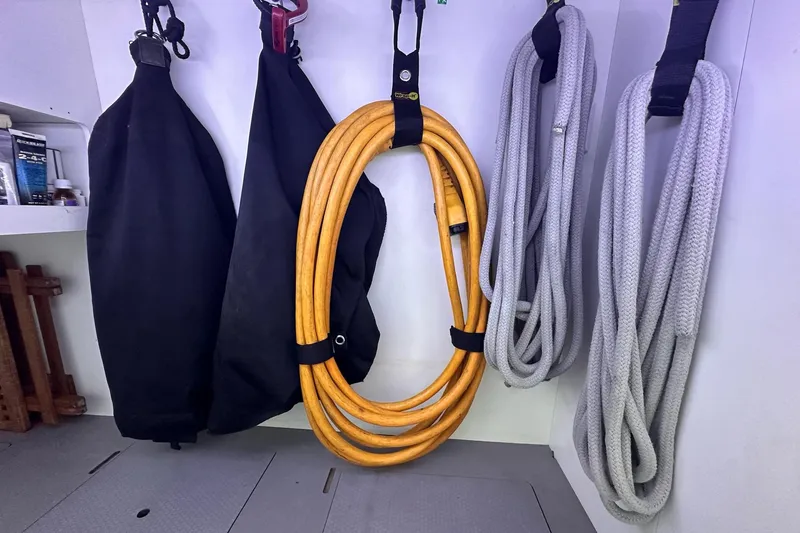 Slide: The Image of Storage area on 2015 Beneteau Swift Trawler 50 with ropes and equipment neatly organized. - 94
