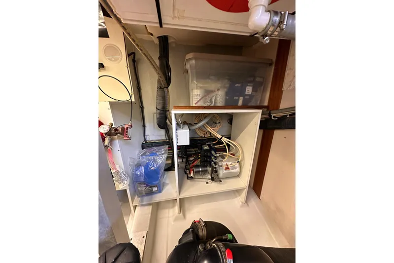 Slide: The Image of Engine room of 2015 Beneteau Swift Trawler 50, showcasing wiring and equipment. - 98