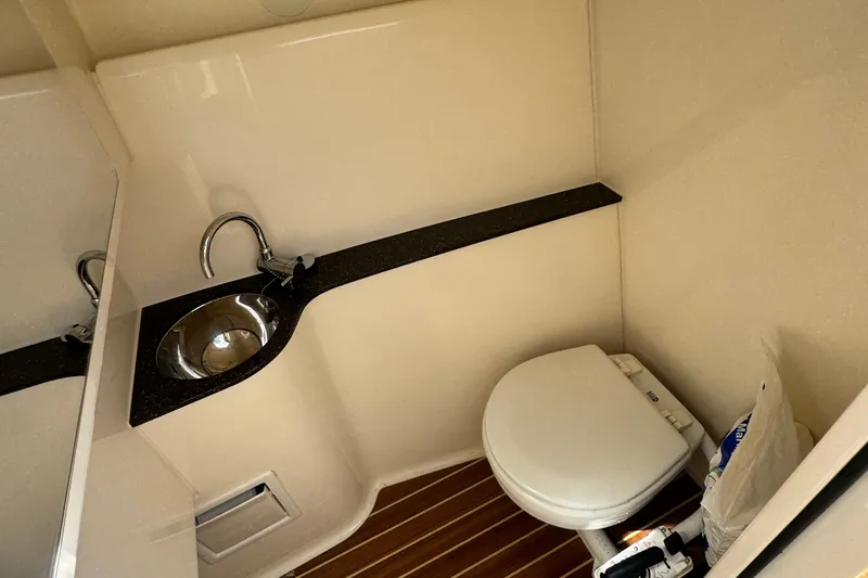 Slide: The Image of 2020 Scout 255 Dorado boat bathroom with sink and toilet. - 19