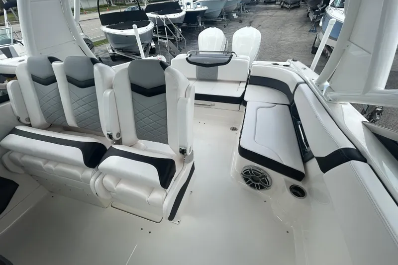 Slide: The Image of 2021 Chaparral 280 OSX boat interior with luxurious seating and modern design. - 14