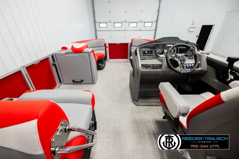 Slide: The Image of Interior of 2026 Avalon LSZ QLS pontoon boat with red and gray seating, modern dashboard. - 17