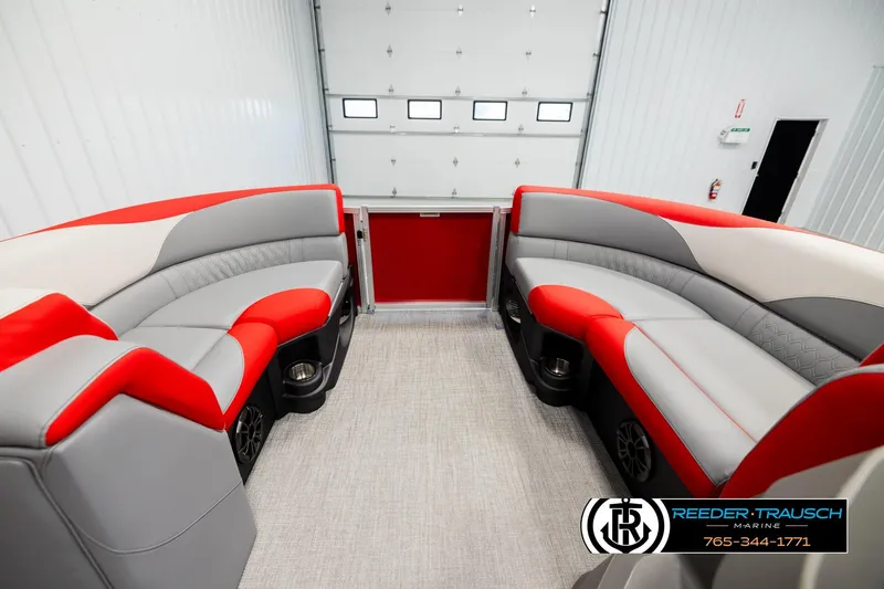 Slide: The Image of Luxurious 2026 Avalon LSZ QLS boat interior with red and gray seating in a showroom. - 18