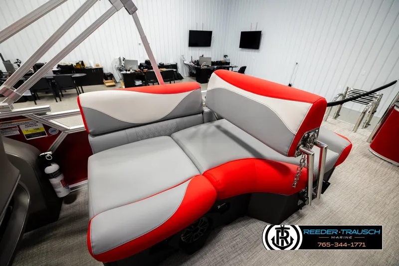 Slide: The Image of 2026 Avalon LSZ QLS boat interior with red and gray seating in showroom. - 25