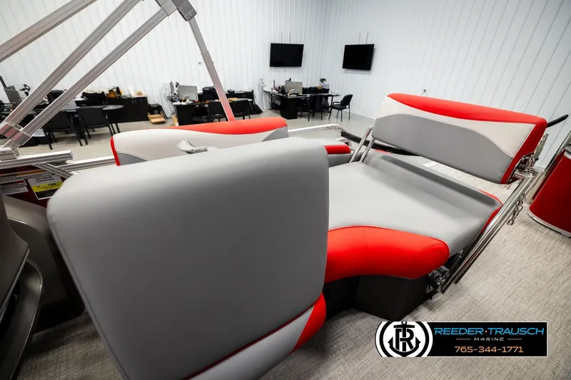 Slide: The Image of 2026 Avalon LSZ QLS boat interior with red and gray seating in showroom. - 28