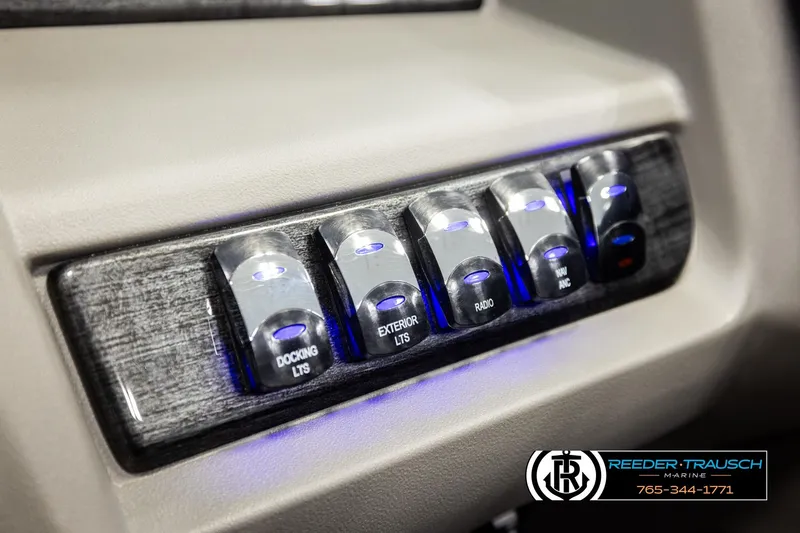 Slide: The Image of Control panel of 2026 Avalon LSZ QLS with illuminated switches for docking, exterior lights, and radio. - 41