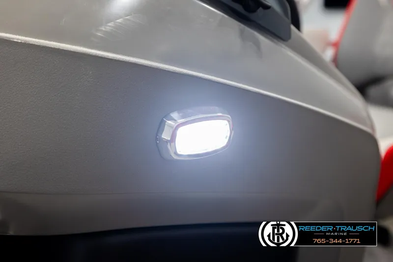 Slide: The Image of 2026 Avalon LSZ QLS boat with illuminated side light, Reeder-Trausch Marine branding. - 46