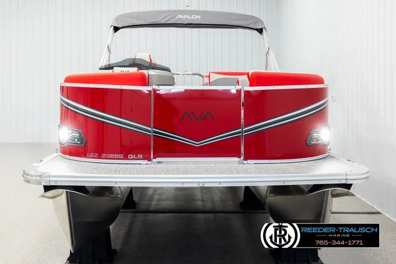 Slide: The Image of 2026 Avalon LSZ QLS pontoon boat, vibrant red, displayed indoors at Reeder-Trausch Marine. - 8