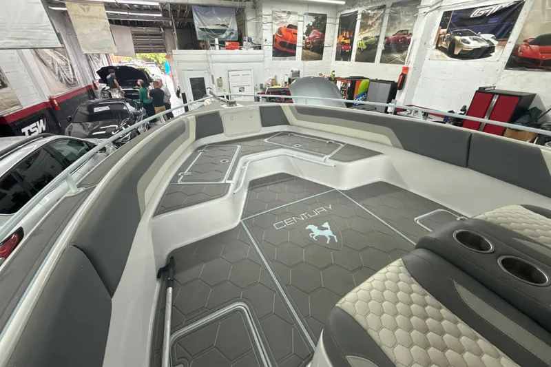 Slide: The Image of 1997 Century 3000 Center Console boat interior with custom flooring in a garage setting. - 14