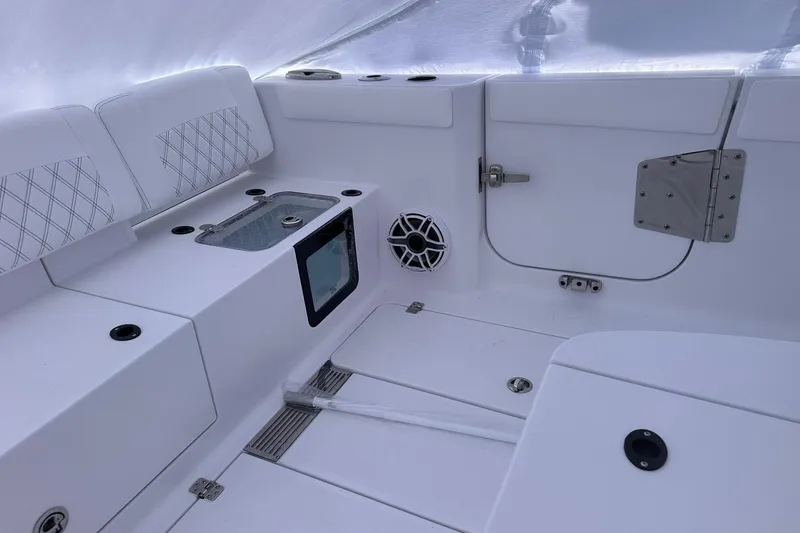 Slide: The Image of 2026 Sportsman Heritage 321 Center Console interior with seating and storage features. - 18