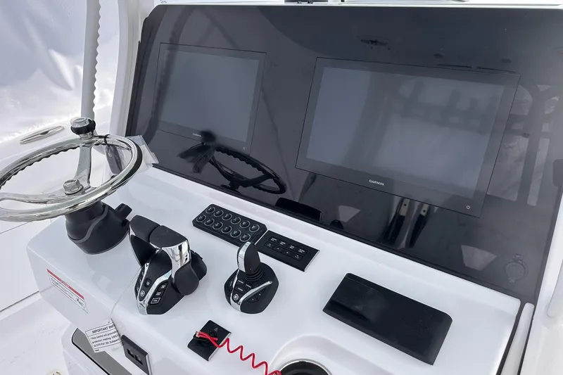 Slide: The Image of 2026 Sportsman Heritage 321 Center Console dashboard with steering wheel and dual displays. - 21