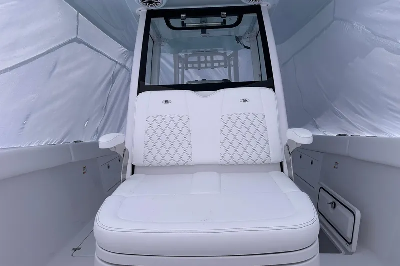 Slide: The Image of 2026 Sportsman Heritage 321 Center Console with white cushioned seating and sleek interior design. - 31