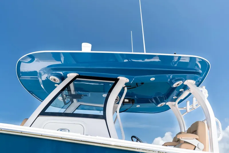 Slide: The Image of Manufacturer Provided Image: 2025 Sportsman Heritage 321 Center Console boat, blue hardtop against clear sky. - 34