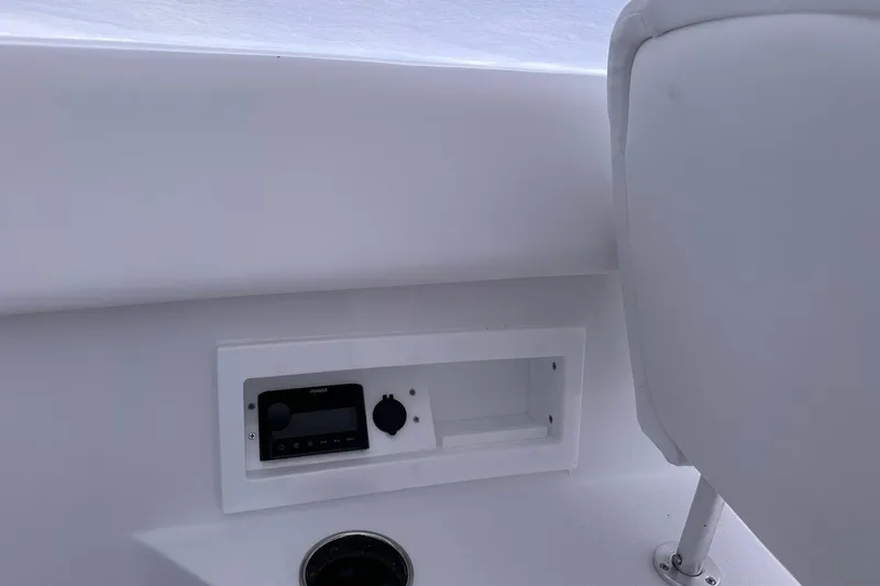 Slide: The Image of 2026 Sportsman Heritage 321 Center Console interior with control panel and seating. - 35