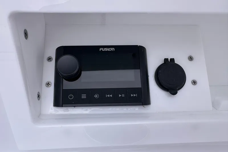 Slide: The Image of Fusion audio system on 2026 Sportsman Heritage 321 Center Console boat dashboard. - 36