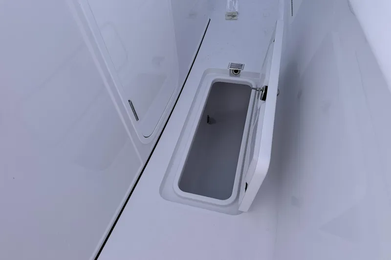 Slide: The Image of Open storage compartment on 2026 Sportsman Heritage 321 Center Console boat. - 39
