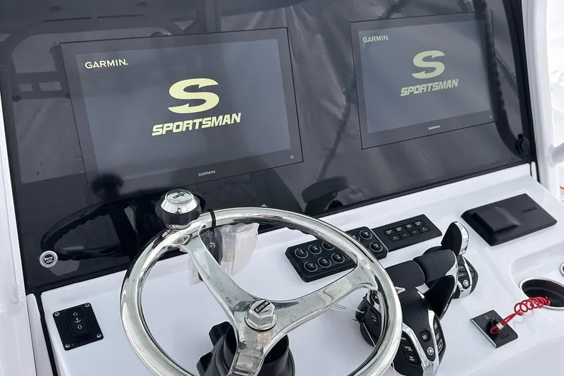Slide: The Image of 2026 Sportsman Heritage 321 Center Console dashboard with dual Garmin displays. - 44