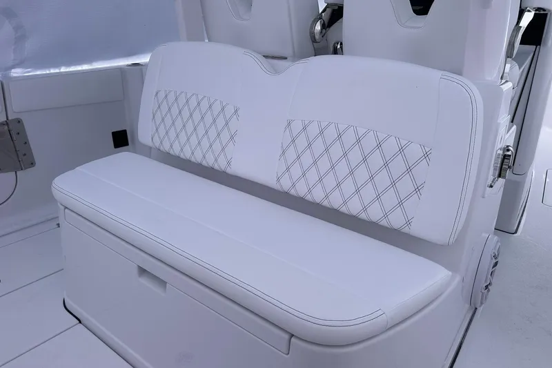 Slide: The Image of 2026 Sportsman Heritage 321 Center Console boat with white cushioned seating. - 52