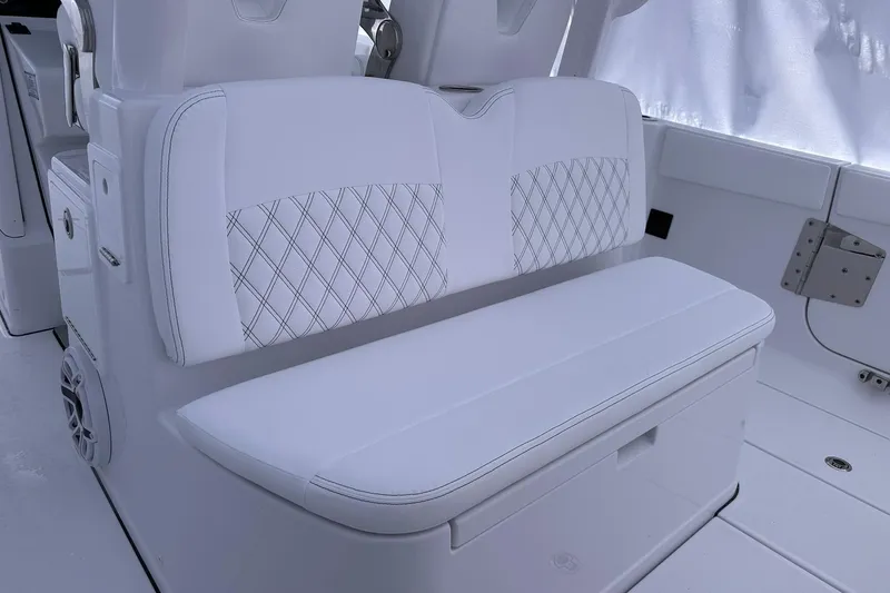 Slide: The Image of 2026 Sportsman Heritage 321 Center Console boat with white cushioned seating. - 53