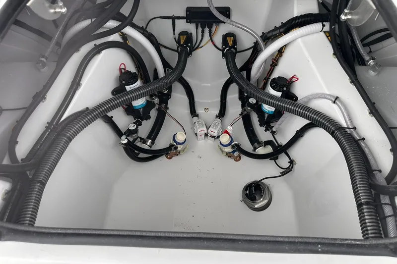 Slide: The Image of 2026 Sportsman Heritage 321 Center Console boat wiring and plumbing system. - 69