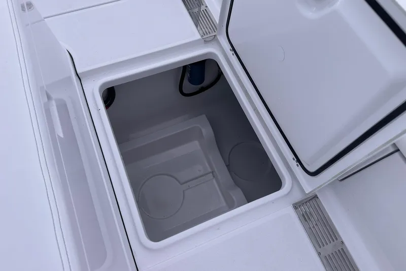 Slide: The Image of Open storage compartment on 2026 Sportsman Heritage 321 Center Console boat. - 71