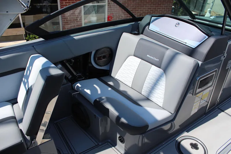 Slide: The Image of 2023 MasterCraft X24 boat interior with stylish seating and modern design. - 13