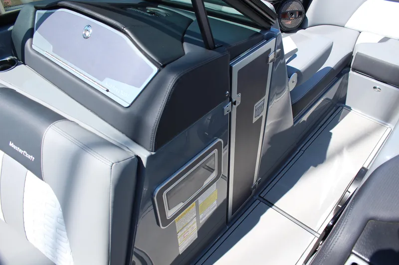 Slide: The Image of 2023 MasterCraft X24 boat interior with sleek seating and modern design features. - 17