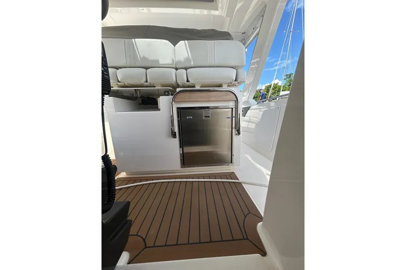 Slide: The Image of 2021 Tiara Yachts 34 LS interior with seating and stainless steel appliance. - 7