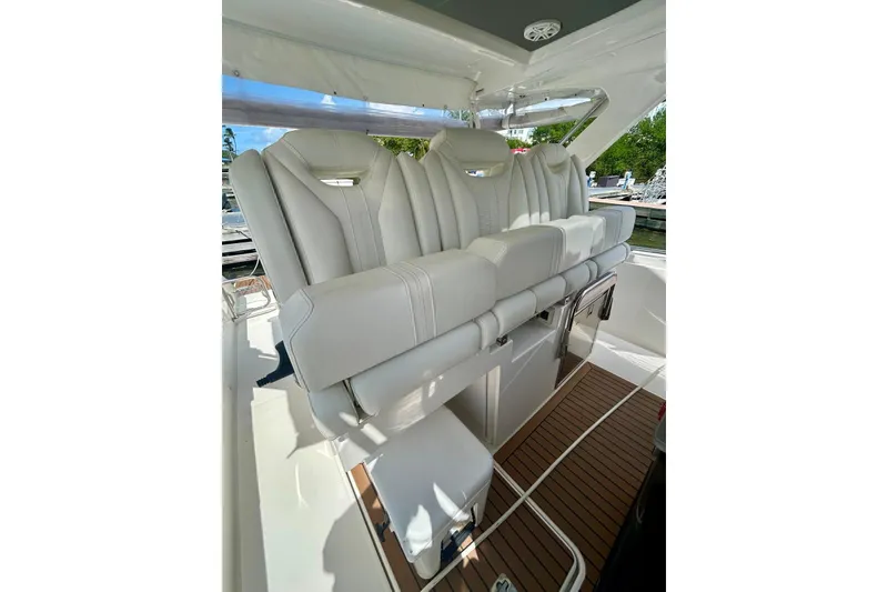 Slide: The Image of Luxurious seating on 2021 Tiara Yachts 34 LS, featuring elegant white upholstery. - 9