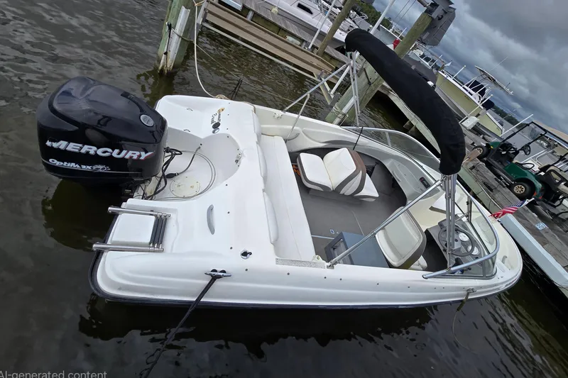 Slide: The Image of 2011 Bayliner 180 Bowrider with Mercury OptiMax engine docked at marina. - 10