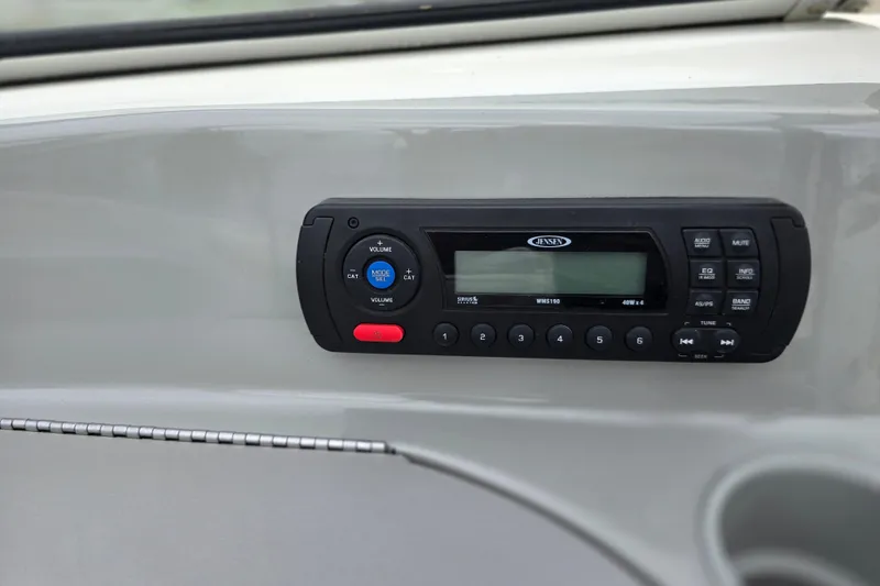 Slide: The Image of Boat stereo system on 2011 Bayliner 180 Bowrider dashboard. - 13